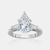 Bague de fiançailles en forme de poire avec pierres latérales trapézoïdes