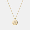 Collier à pendentif rond avec initiale en diamants