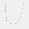 Collier avec initiales en cursive de diamants