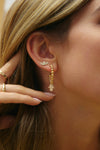 boucle d'oreille perlée Hamsa en diamant
