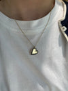 Collier en forme de cœur bordé de diamants noirs