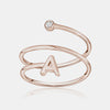 Bague spirale avec initiale et chaton en diamant