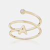 Bague spirale avec initiale et chaton en diamant