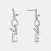 Boucles d'Oreilles "LOVE" pendant en Diamant