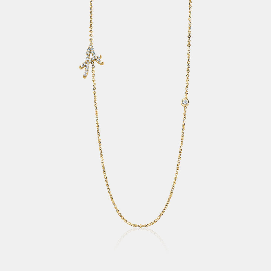 Collier avec initiales en cursive et lunette en diamant