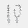 boucle d'oreille perlée Hamsa en diamant